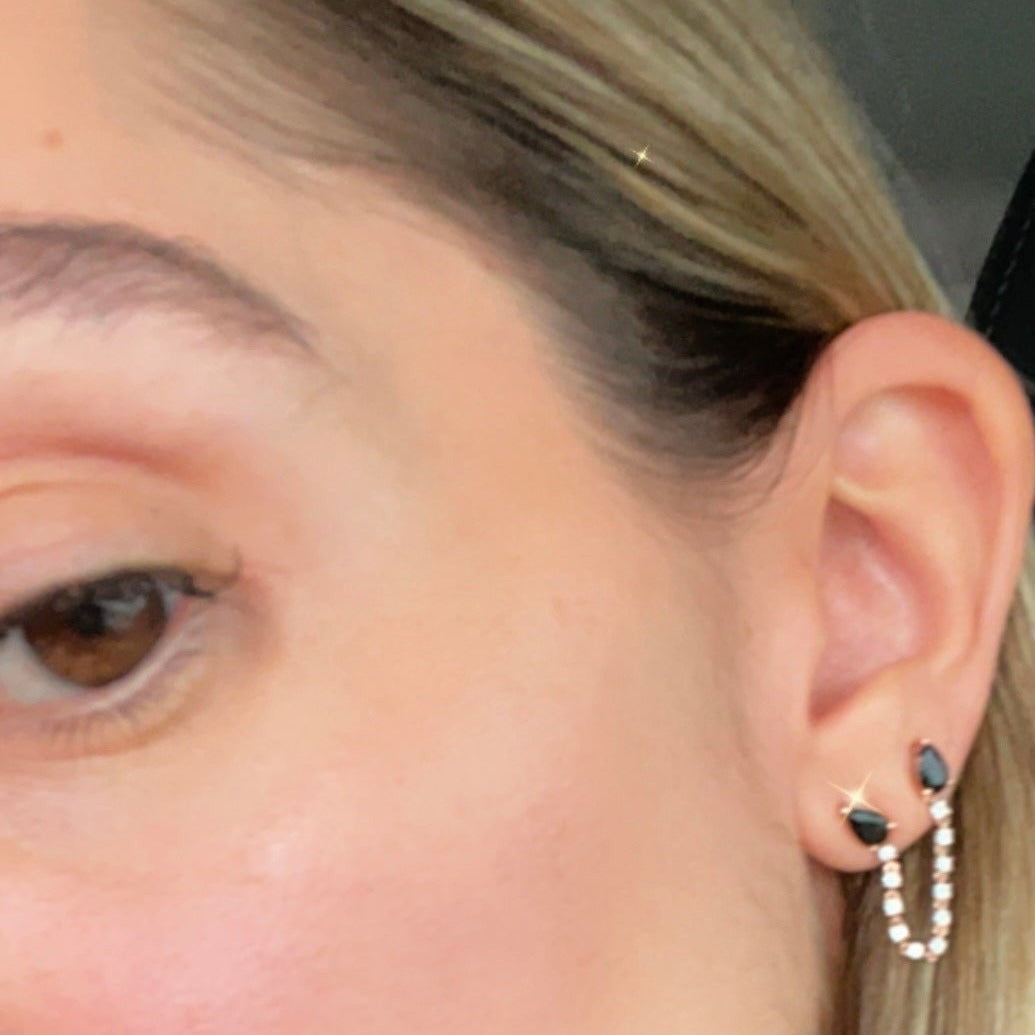 Double piercing loop earring with diamonds and black spinal pear studs